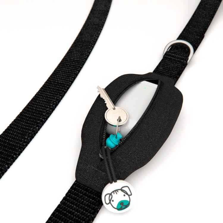 Dog leash with built-in black pouch which is open and storing a key and AirPods