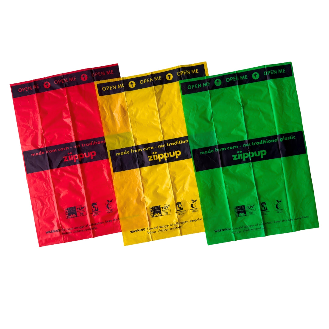 Ziippup compostable dog poop bags in red, yellow and green. Made from corn - not traditional plastic.
