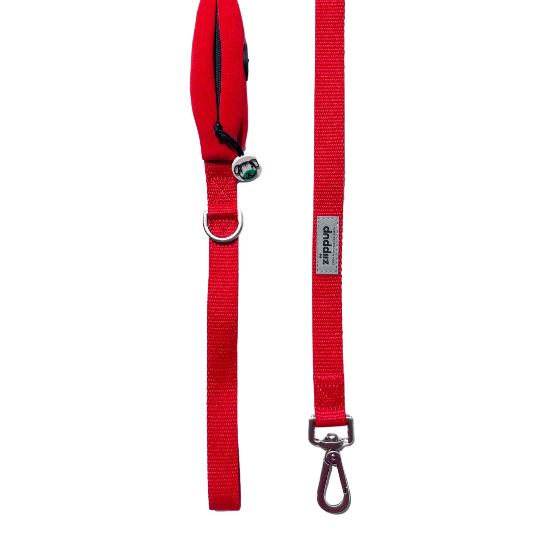 Detailed view of red dog lead with built-in poo bag holder